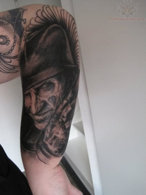 Grey Ink Freddy Krueger Tattoo On Left Forearm